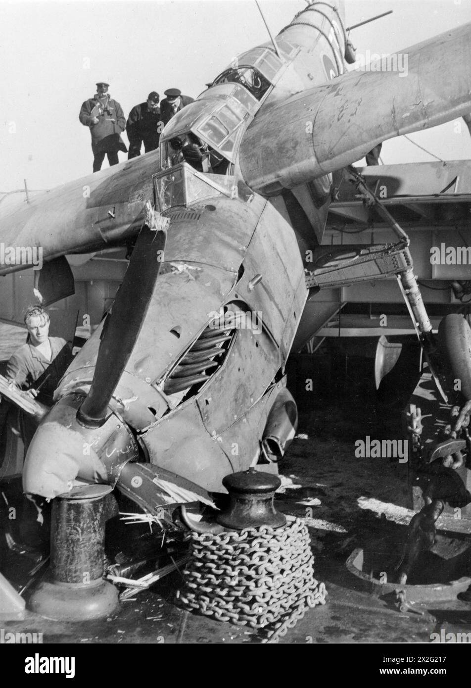 DECK LANDING TRAINING ON HMS RAJAH. 1944. - This Fairey Barracuda overshot the mark when taxi-ing forward of the barrier after landing on and crashed on to the fo`c'sle. The pilot was unhurt. DLT, 14 August 1944 , Stock Photo